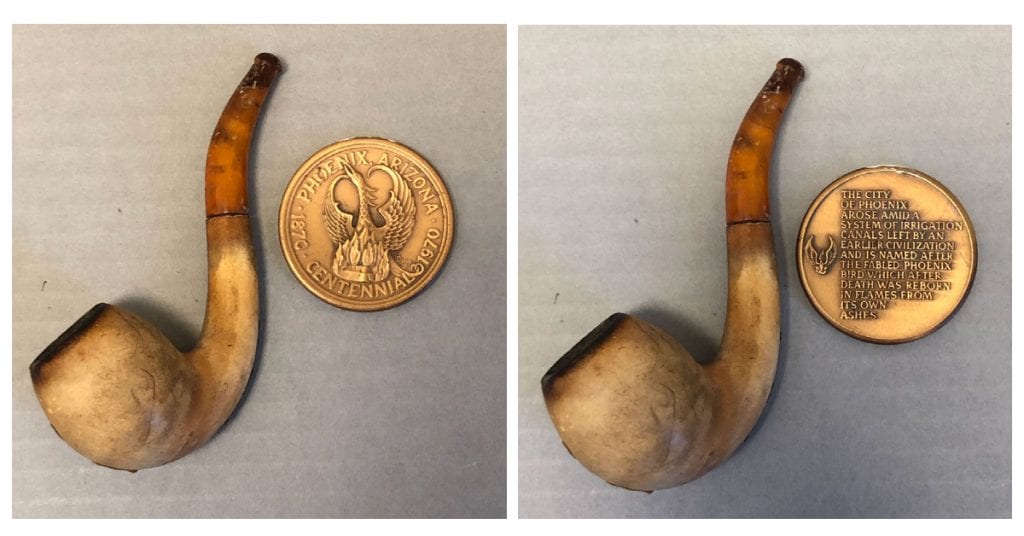 Left: Darryl Duppa's pipe (AHS Collections, P85.52.51.1-.2) Right: A commemorative coin from the Phoenix Centennial in 1970 (AHS Collections, P87.3.81)